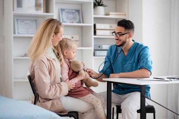 Family receiving a comprehensive physical exam at a Houston urgent care center.